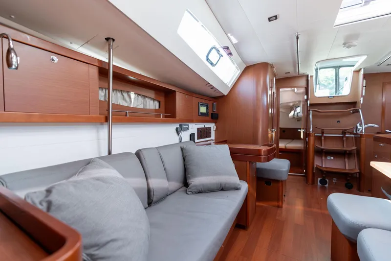 Slide: The Image of Luxurious interior of 2013 Beneteau Oceanis 50 yacht with modern furnishings and wood finish. - 11
