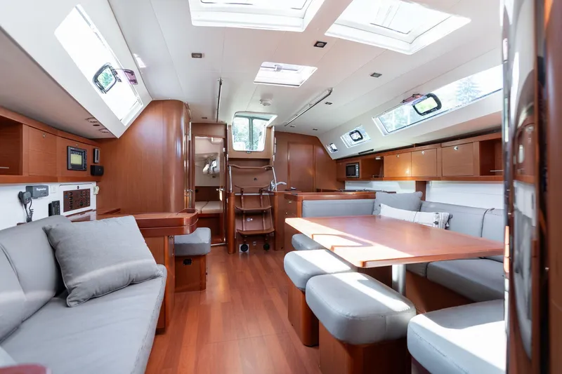 Slide: The Image of Spacious interior of 2013 Beneteau Oceanis 50 yacht with modern furnishings and ample natural light. - 21
