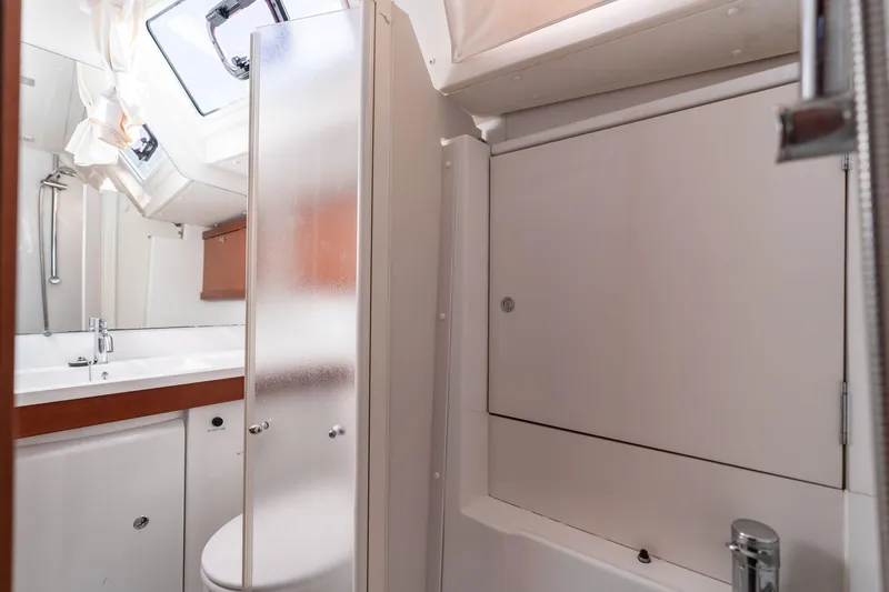 Slide: The Image of Bathroom interior of 2013 Beneteau Oceanis 50 yacht, featuring modern fixtures and frosted glass. - 26