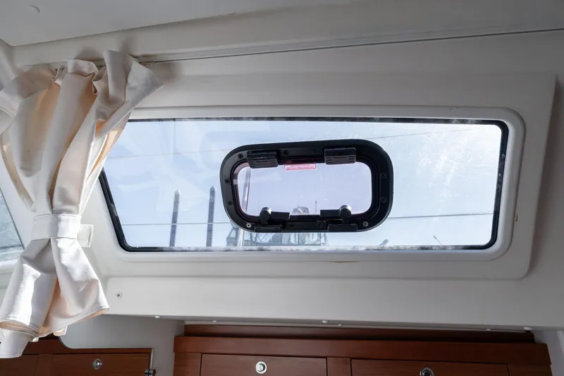 Slide: The Image of Interior view of a 2013 Beneteau Oceanis 50 yacht window with curtain. - 30