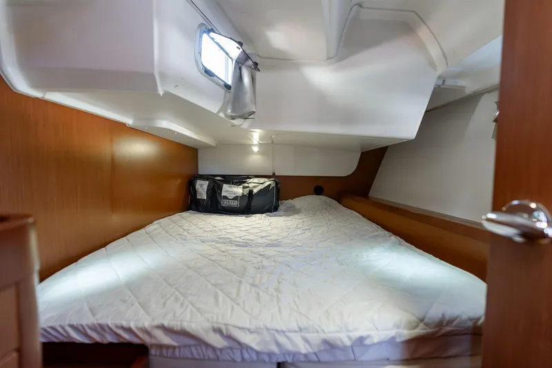 Slide: The Image of Cozy cabin interior of 2013 Beneteau Oceanis 50 sailboat with comfortable bedding. - 38