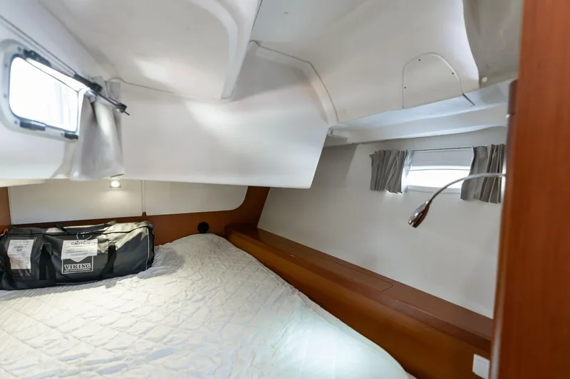 Slide: The Image of Cozy cabin interior of 2013 Beneteau Oceanis 50 sailboat with bed and porthole. - 39