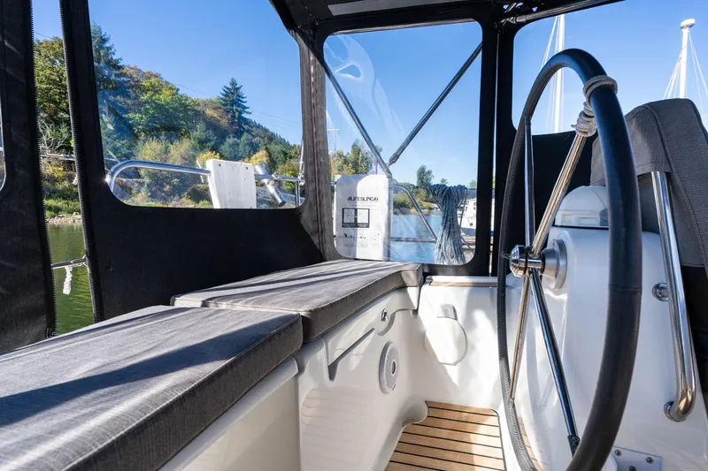 Slide: The Image of Interior view of 2013 Beneteau Oceanis 50 sailboat cockpit with steering wheel. - 45