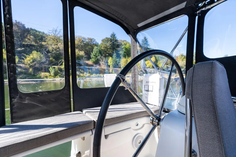 Slide: The Image of Cockpit view of 2013 Beneteau Oceanis 50 sailboat with steering wheel and seating. - 46