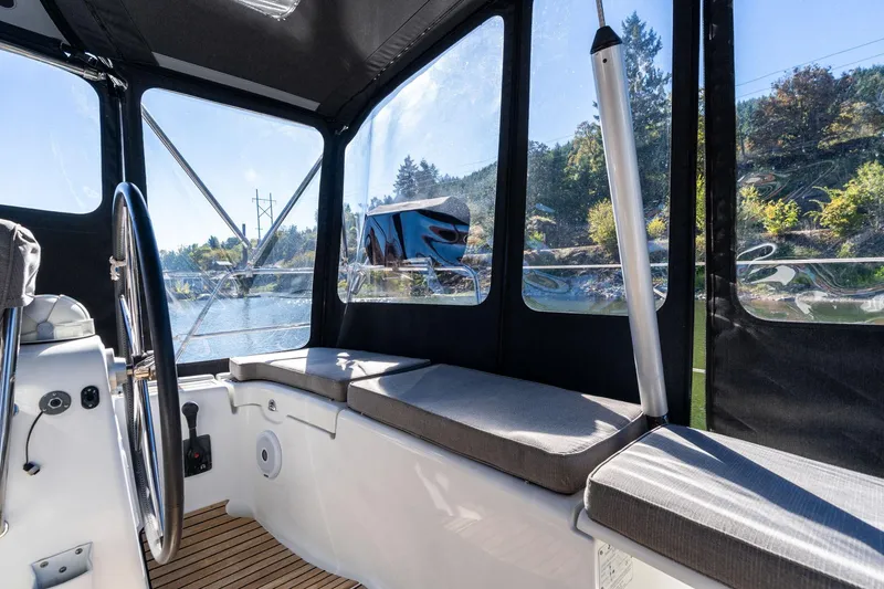 Slide: The Image of Interior view of 2013 Beneteau Oceanis 50 sailboat cockpit with seating and steering wheel. - 47
