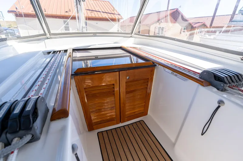 Slide: The Image of Cockpit view of 2013 Beneteau Oceanis 50 sailboat with wooden hatch and deck. - 5