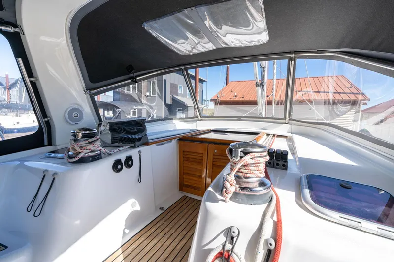 Slide: The Image of Interior view of 2013 Beneteau Oceanis 50 sailboat cockpit with winches and ropes. - 54