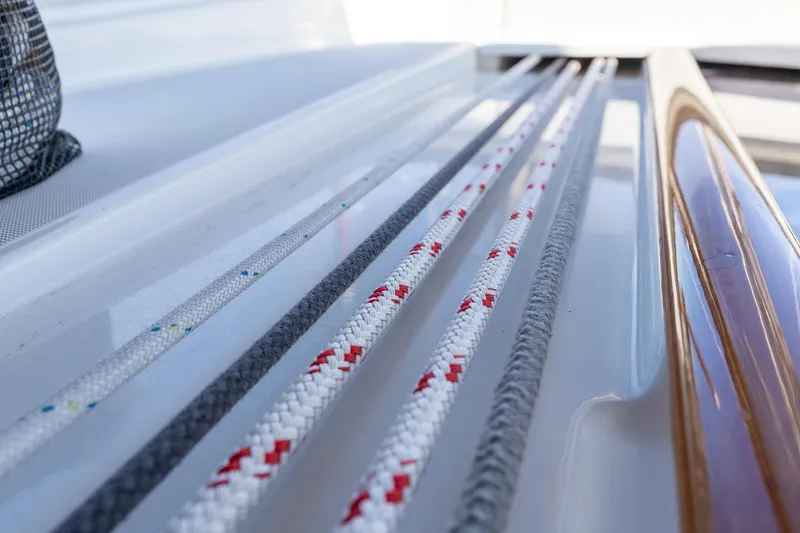 Slide: The Image of Close-up of ropes on a 2013 Beneteau Oceanis 50 sailboat deck. - 57