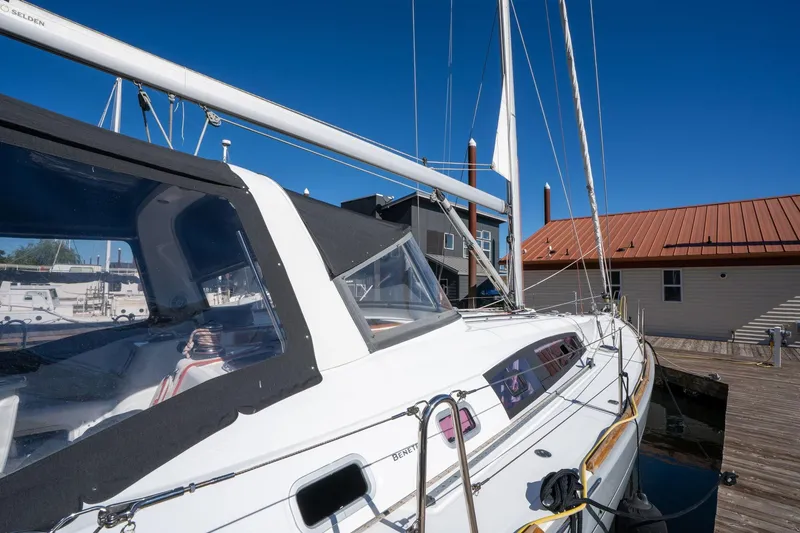 Slide: The Image of 2013 Beneteau Oceanis 50 sailboat docked, showcasing sleek design and modern features. - 61