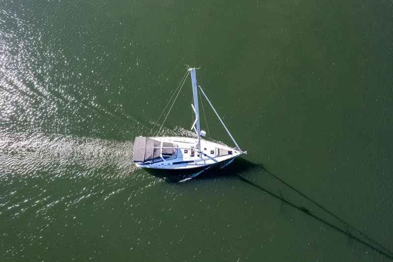 Slide: The Image of Aerial view of 2013 Beneteau Oceanis 50 sailing on calm green waters. - 69