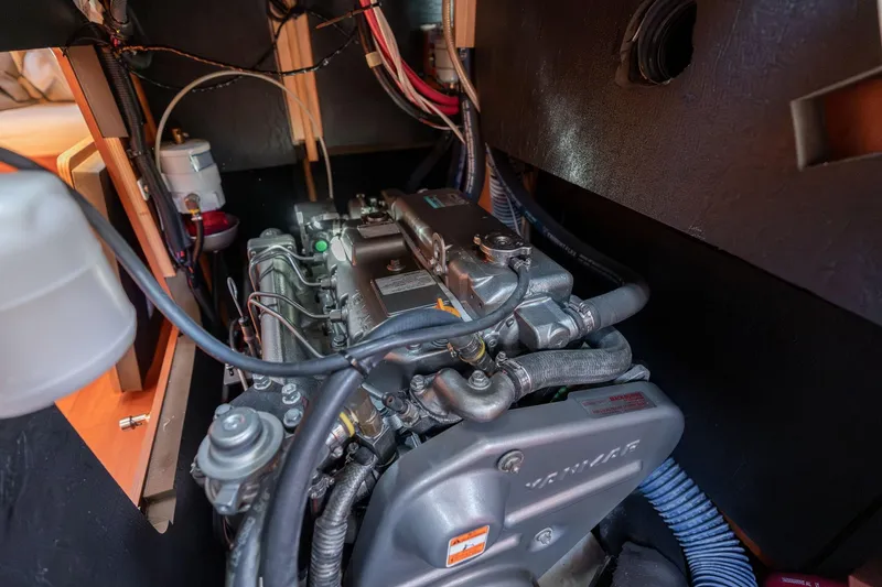 Slide: The Image of Engine compartment of a 2013 Beneteau Oceanis 50 sailboat, featuring a Yanmar engine. - 75