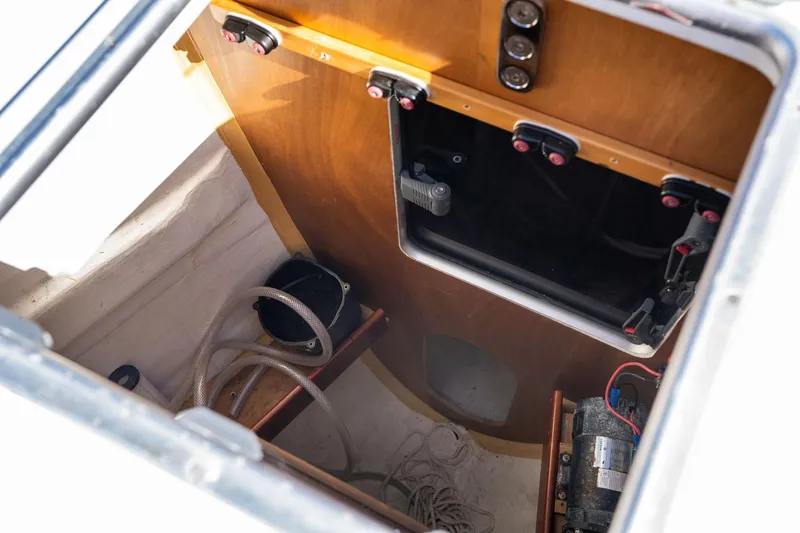 Slide: The Image of Interior view of 2013 Beneteau Oceanis 50 sailboat compartment with ropes and equipment. - 77