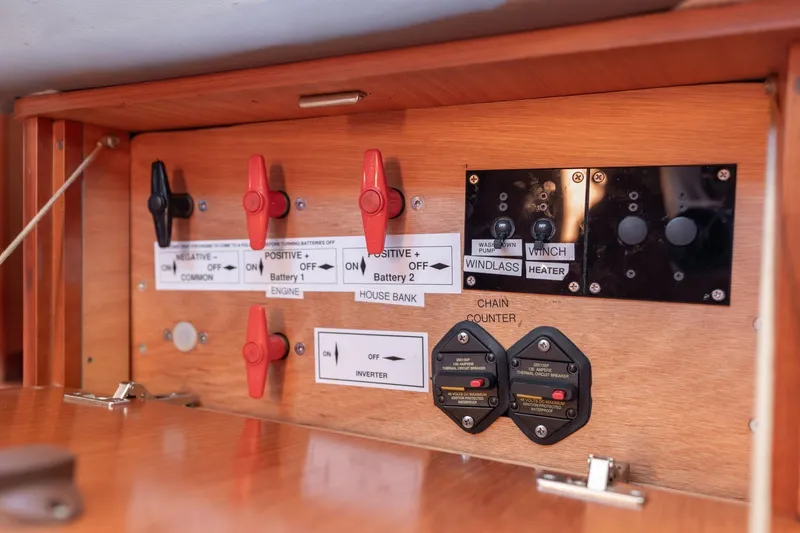 Slide: The Image of Electrical control panel on a 2013 Beneteau Oceanis 50 yacht, featuring switches and circuit breakers. - 79
