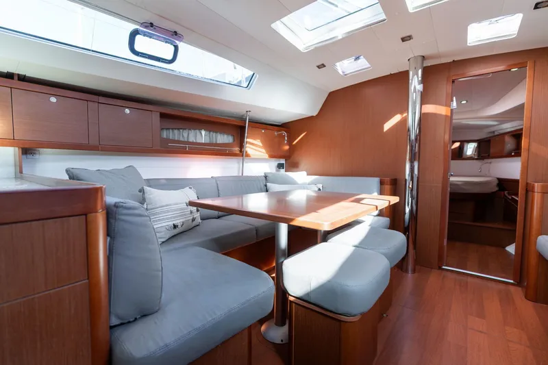 Slide: The Image of Luxurious interior of 2013 Beneteau Oceanis 50 yacht with elegant wood finish and skylights. - 8