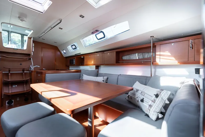 Slide: The Image of Luxurious interior of 2013 Beneteau Oceanis 50 yacht with modern seating and ample natural light. - 9