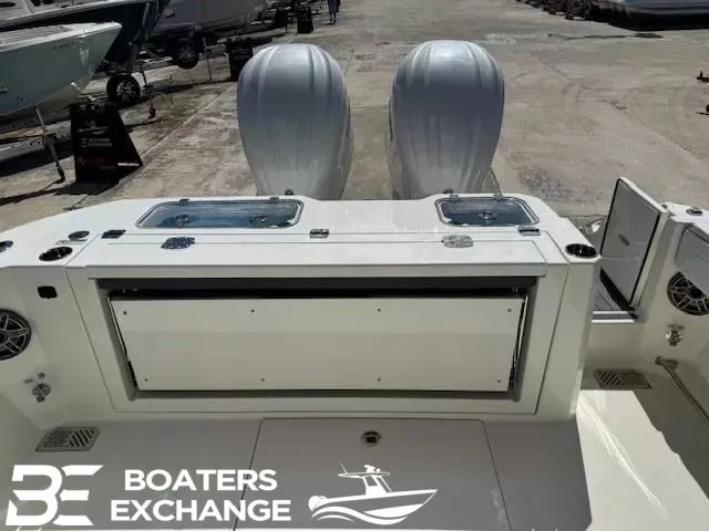 Slide: The Image of Cobia 305 Center Console 2026 with dual outboard engines. - 4