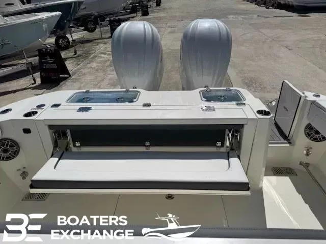 Slide: The Image of 2026 Cobia 305 Center Console with dual outboard engines. - 5