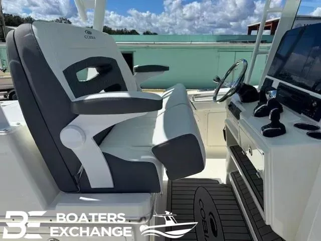 Slide: The Image of Cobia 305 Center Console 2026 with helm and seating area. - 6