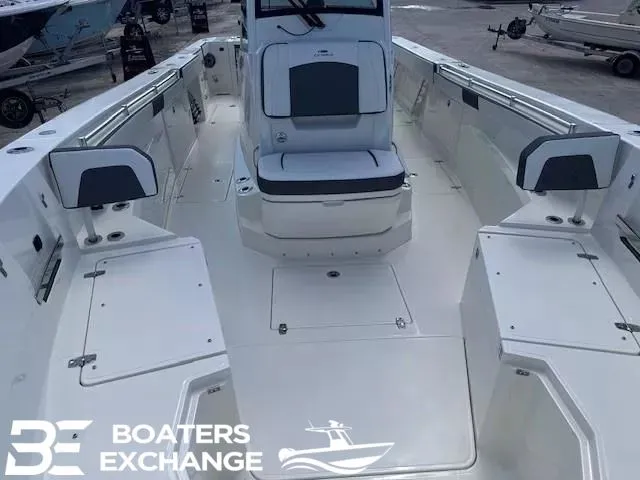 Slide: The Image of 2026 Cobia 305 Center Console displayed at boat show. - 9