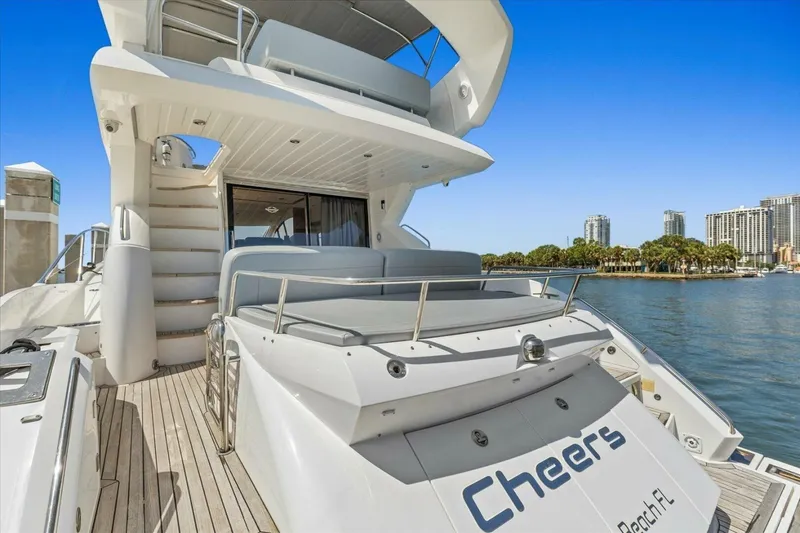 Slide: The Image of 2009 Sunseeker Manhattan 52 yacht docked, featuring spacious deck and luxurious design. - 10