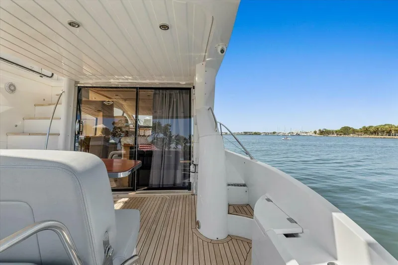 Slide: The Image of 2009 Sunseeker Manhattan 52 yacht deck with ocean view and luxurious interior. - 16