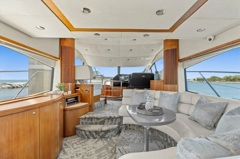 Slide: The Image of Luxurious interior of 2009 Sunseeker Manhattan 52 yacht with elegant seating and panoramic windows. - 21