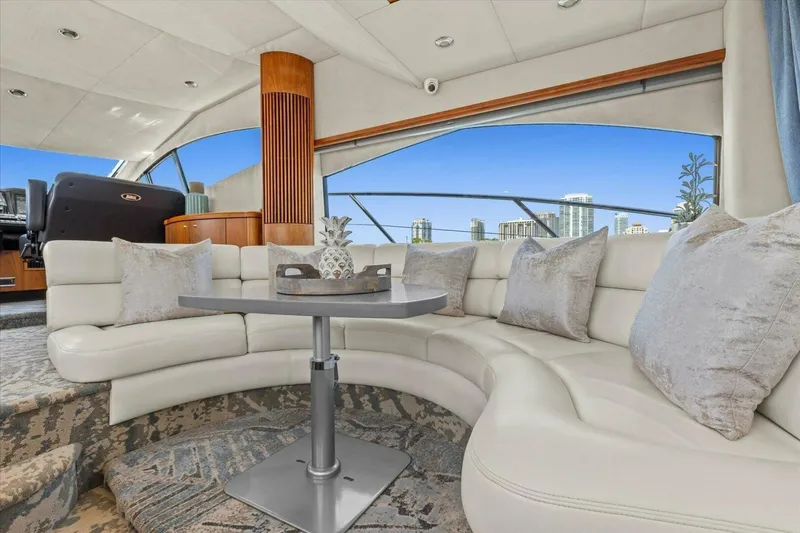 Slide: The Image of Luxurious 2009 Sunseeker Manhattan 52 yacht interior with modern helm and scenic waterfront view. - 25