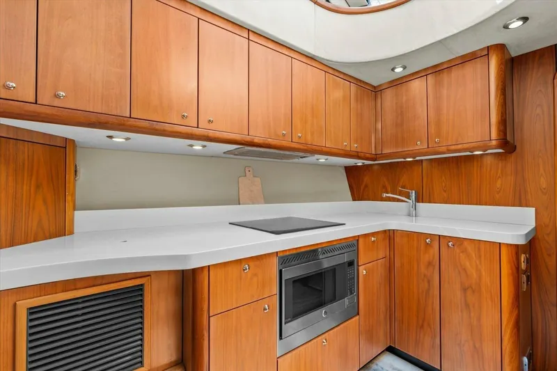 Slide: The Image of Luxurious bathroom in 2009 Sunseeker Manhattan 52 yacht with modern fixtures and wood accents. - 36