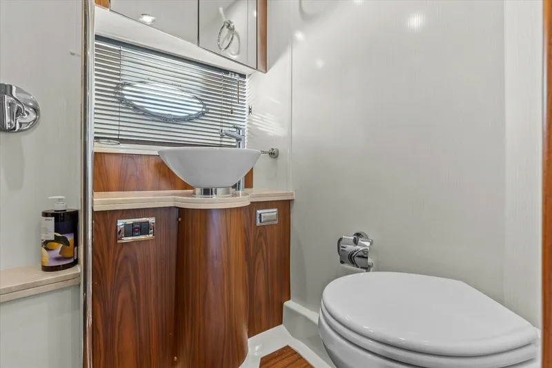 Slide: The Image of Luxurious bathroom in 2009 Sunseeker Manhattan 52 yacht with modern fixtures and wood accents. - 37