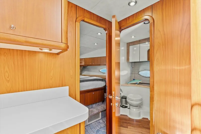 Slide: The Image of Luxurious bedroom interior of 2009 Sunseeker Manhattan 52 yacht with elegant wood finishes. - 39