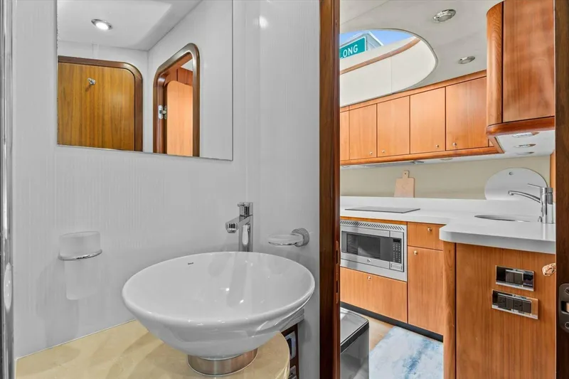 Slide: The Image of Bunk beds in 2009 Sunseeker Manhattan 52 yacht cabin with wooden door. - 42