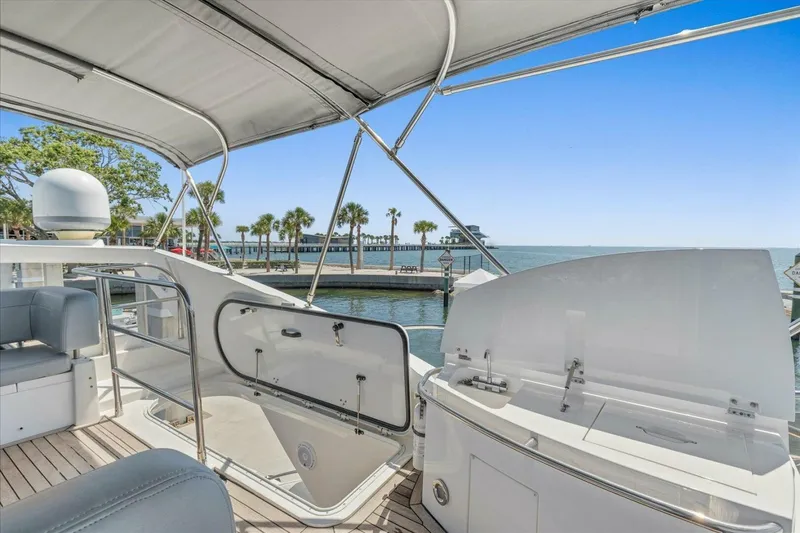 Slide: The Image of Flybridge of 2009 Sunseeker Manhattan 52 yacht with city skyline view. - 54