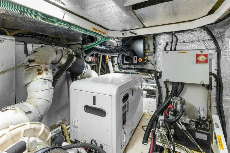 Slide: The Image of 2009 Sunseeker Manhattan 52 yacht on water with city skyline in background. - 62