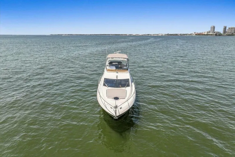Slide: The Image of 2009 Sunseeker Manhattan 52 yacht cruising near city skyline on a sunny day. - 65