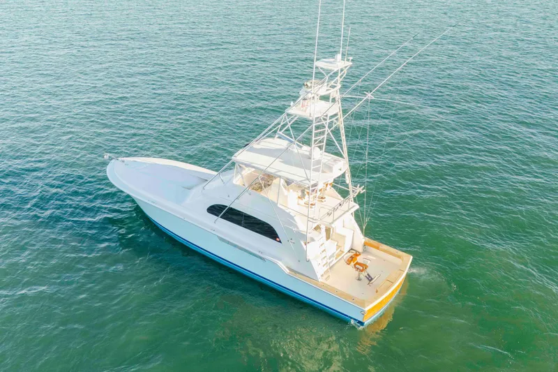 Slide: The Image of Aerial view of 1999 Bertram 60 Convertible yacht on open water. - 11