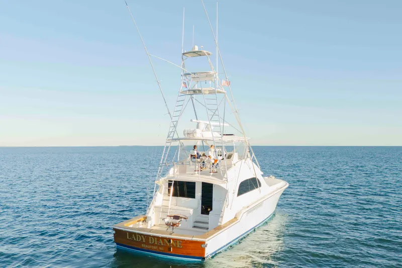 Slide: The Image of 1999 Bertram 60 Convertible yacht "Lady Dianne" cruising on open sea. - 15