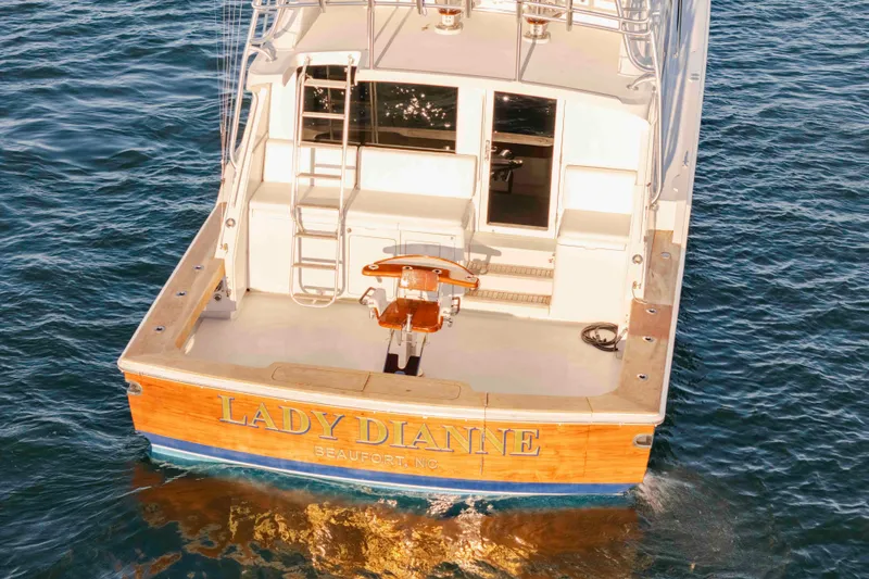 Slide: The Image of 1999 Bertram 60 Convertible yacht "Lady Dianne" on water, rear view. - 5