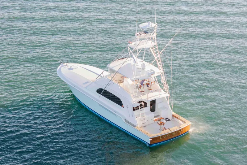 Slide: The Image of 1999 Bertram 60 Convertible yacht cruising on open water. - 7