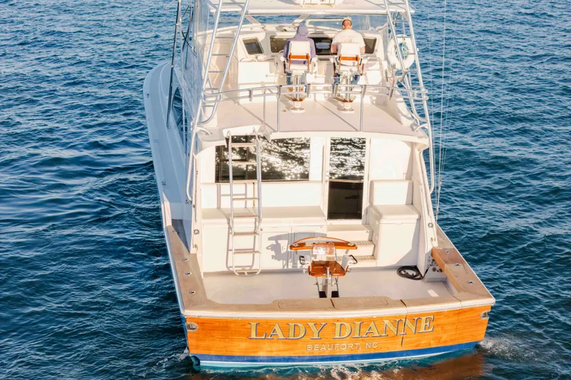 Slide: The Image of 1999 Bertram 60 Convertible yacht "Lady Dianne" cruising on open water. - 9