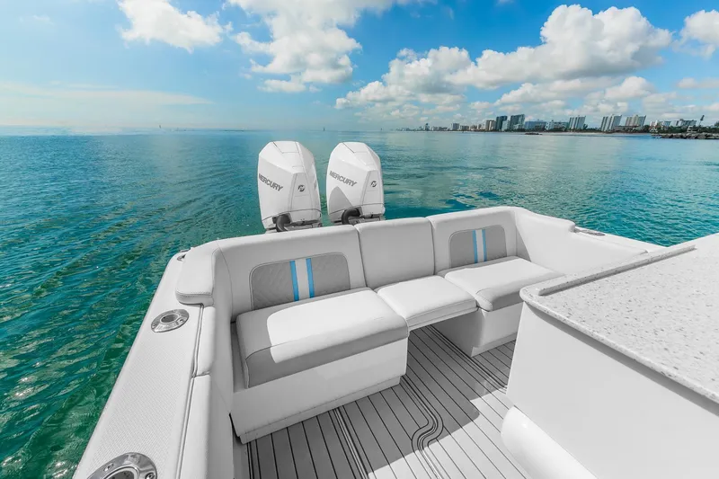 Slide: The Image of 2023 Powerplay Powerboats 30 with twin Mercury engines, luxurious seating, ocean view. - 2