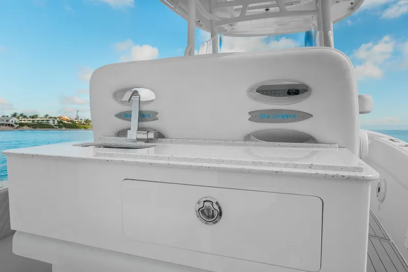 Slide: The Image of 2023 Powerplay Powerboats 30 with sleek white interior and modern amenities. - 5