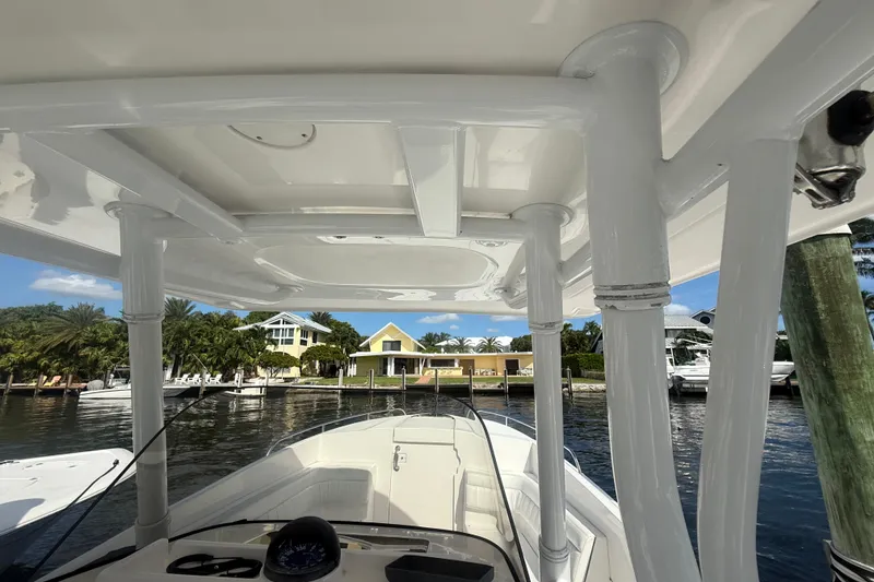 Slide: The Image of 2013 Intrepid 327 Cuddy boat interior with waterfront view. - 11