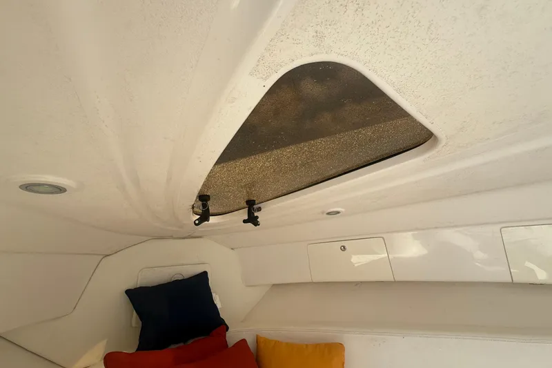 Slide: The Image of Interior cabin of 2013 Intrepid 327 Cuddy with cushions and overhead hatch. - 18