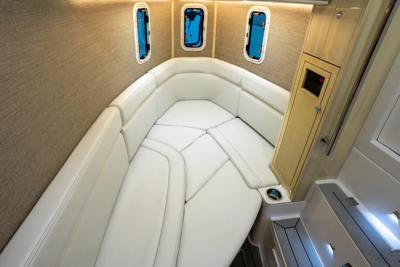 Slide: The Image of Luxurious seating on 2024 HCB 42 Lujo boat, cruising on open water. - 25