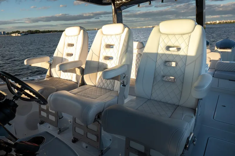 Slide: The Image of 2024 HCB 42 Lujo luxury boat interior with elegant seating and scenic water view. - 31