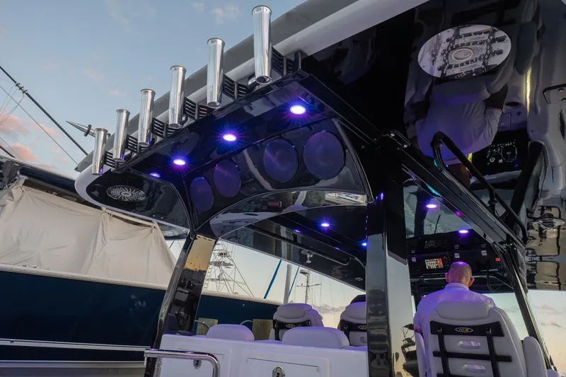 Slide: The Image of 2024 HCB 42 Lujo luxury boat interior with quilted seating at sunset. - 37