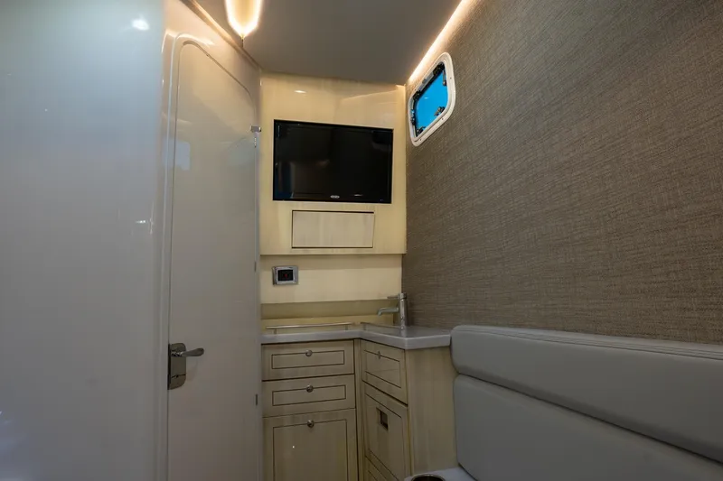 Slide: The Image of 2024 HCB 42 Lujo boat with covered seating area on deck. - 45