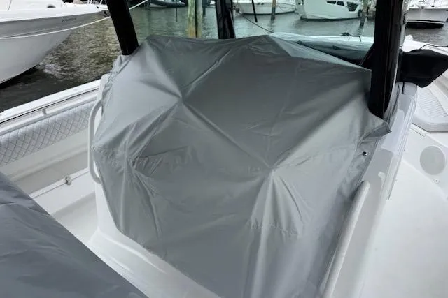 Slide: The Image of 2024 HCB 42 Lujo boat detail with modern design against a clear sky. - 52