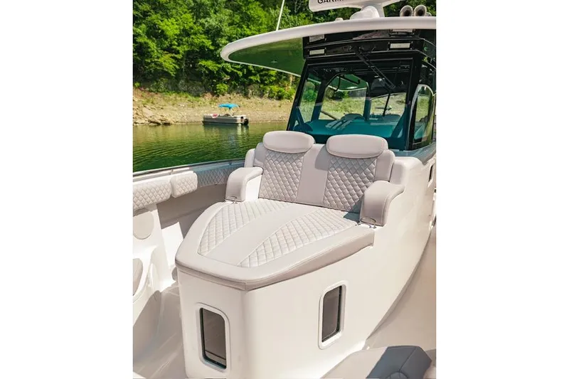 Slide: The Image of 2024 HCB 42 Lujo boat control panel with joystick and illuminated buttons. - 58