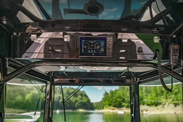 Slide: The Image of 2024 HCB 42 Lujo boat seat with logo, featuring sleek black and beige design. - 59